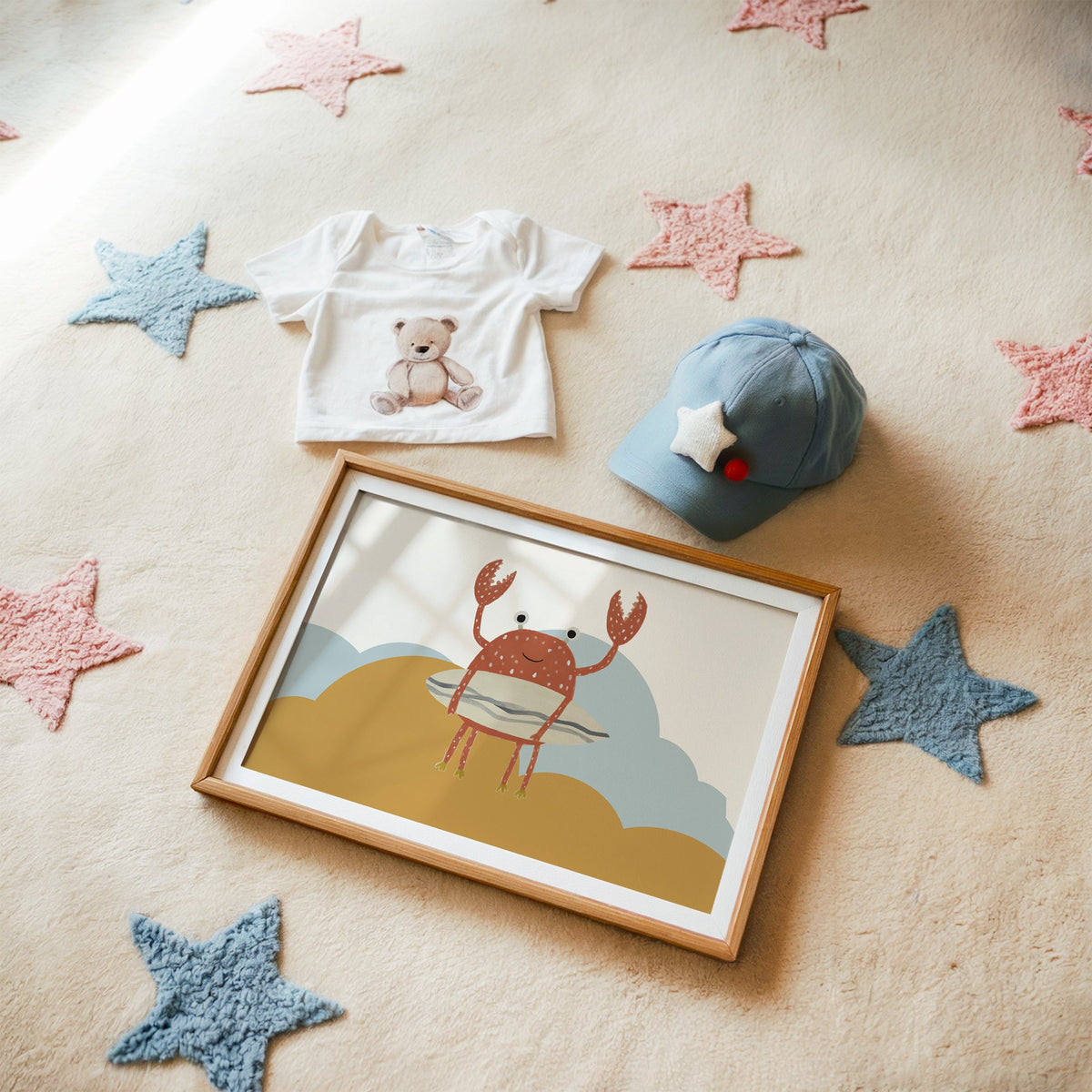 Landscape surfing crab mustard hills nursery print in a matted oak frame on a star rug with a baby tee