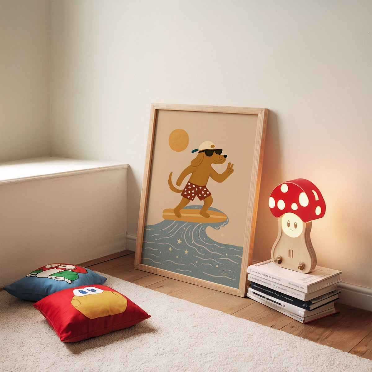 Surfing dog with peace sign nursery print in an oak frame leaning on a rug beside a mushroom lamp and floor cushions