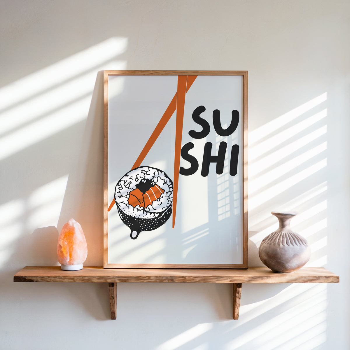 Sushi roll print in an oak frame on a live-edge shelf beside a salt lamp