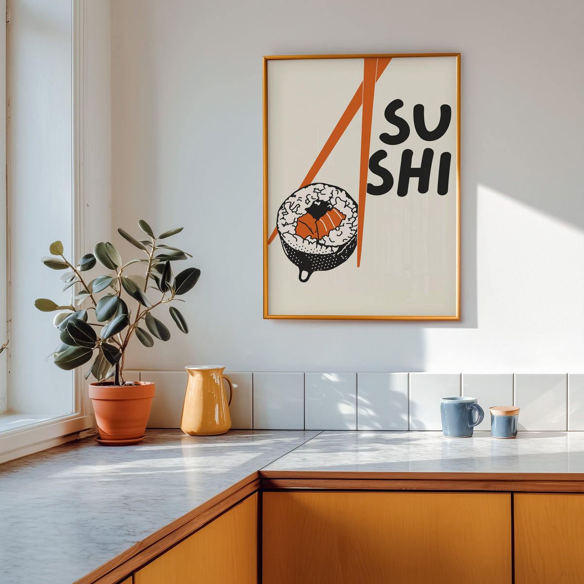 Sushi roll print shown in a gold frame above a marble counter in a tan kitchen