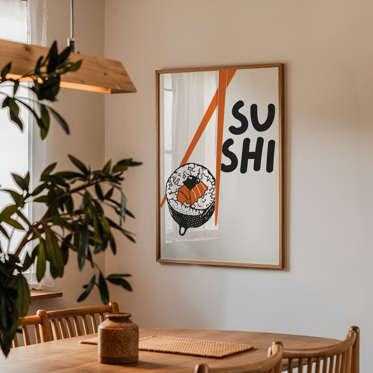 Sushi roll print in a walnut frame above a dining table with olive branches