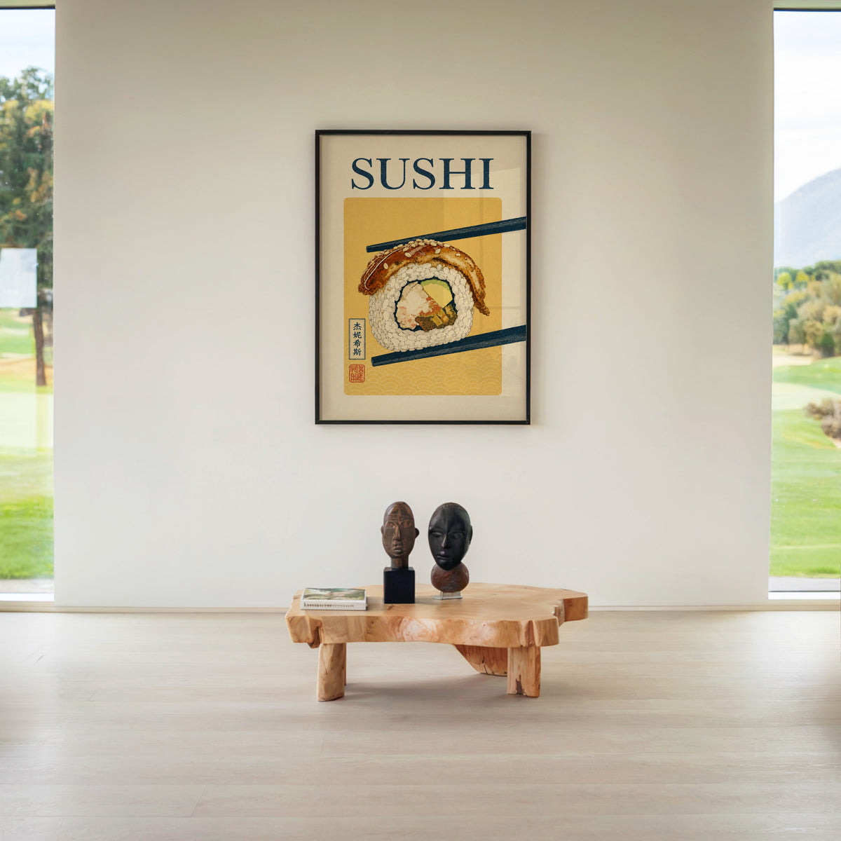 sushi roll in navy chopsticks print in a black frame above a live-edge wood coffee table between garden windows