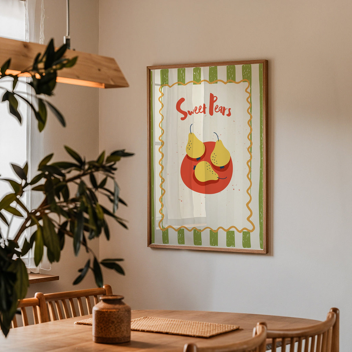 Sweet Pears print in a walnut frame above a dining table with olive branches