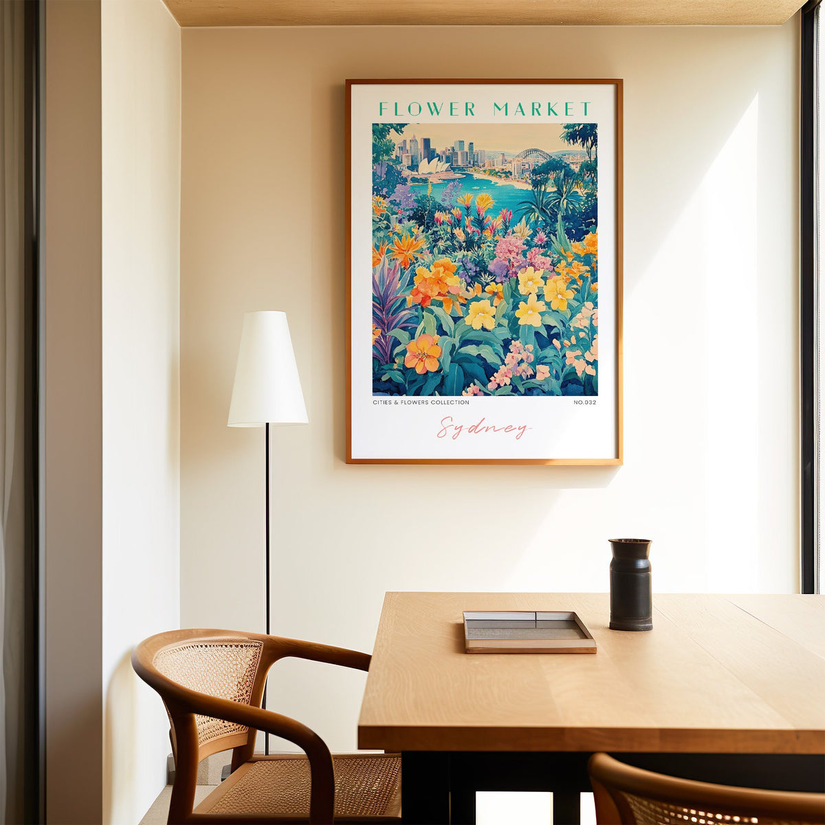 Sydney flower market print in an oak frame above a dining table and cane chair
