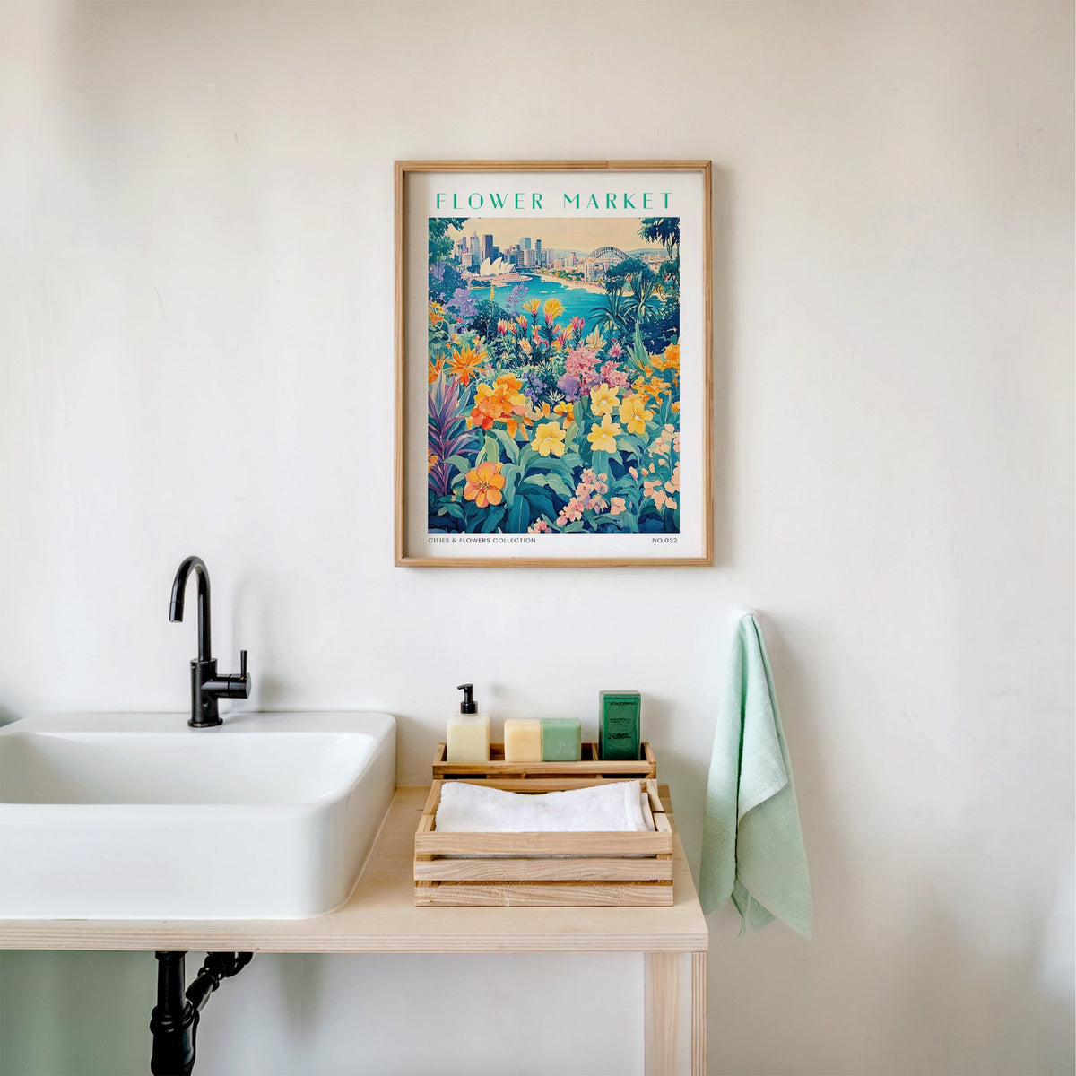 Sydney flower market print in an oak frame above a white bathroom sink with folded towels