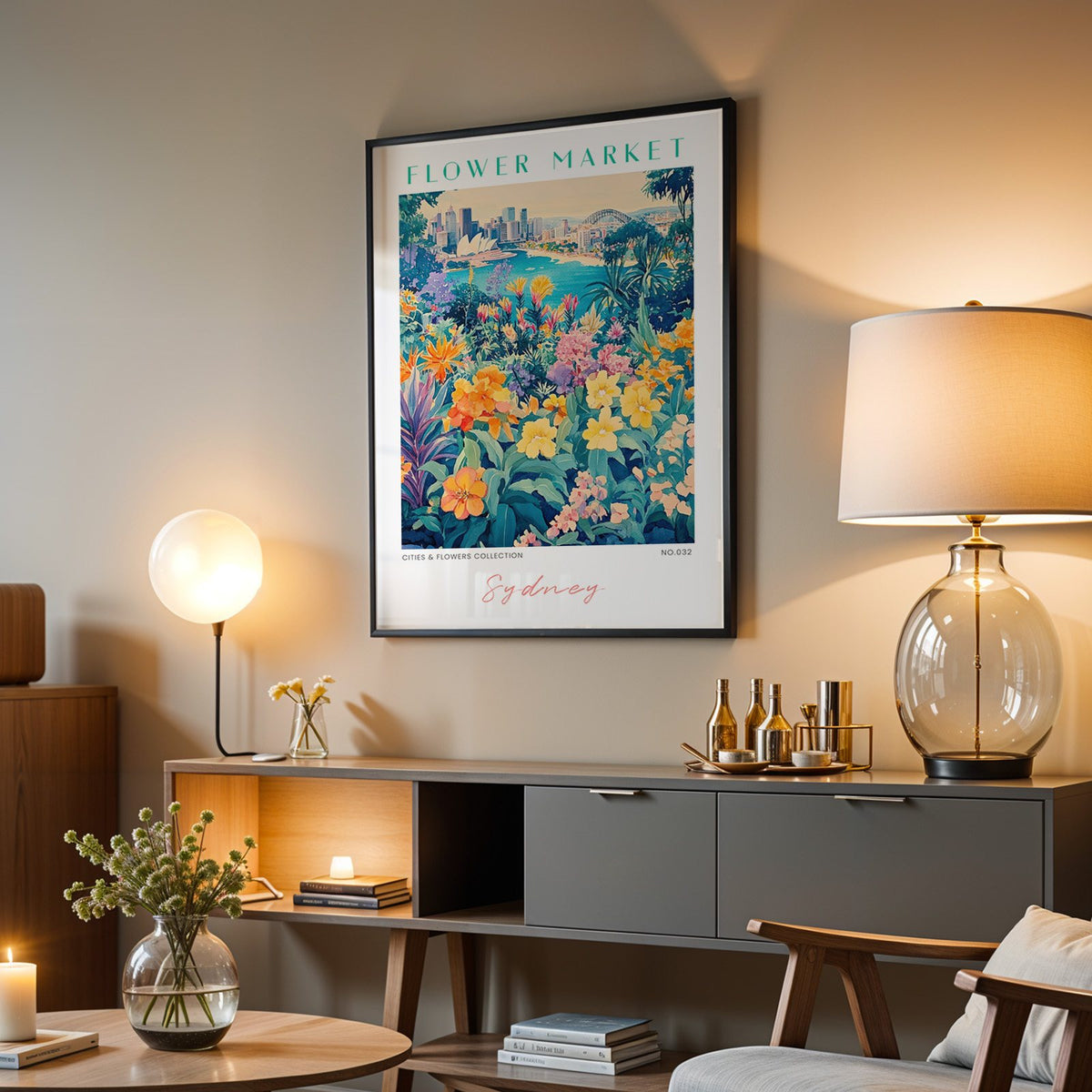 Sydney flower market print in a black frame above a grey media console with a glass table lamp