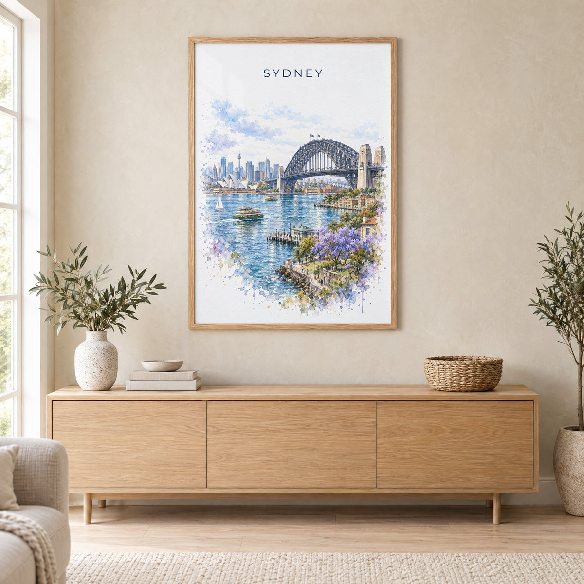 Sydney Harbour Bridge watercolor print in an oak frame above a light wood sideboard in a Scandinavian living room
