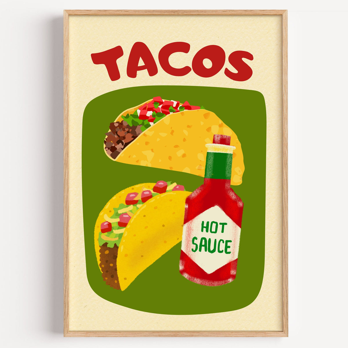 Tacos and hot sauce print in a light oak frame on a plain white wall