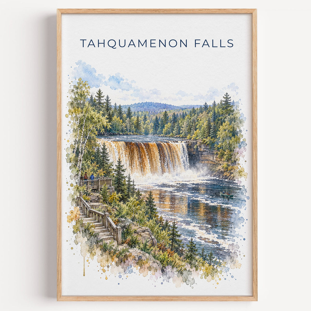 Tahquamenon Falls watercolor print in a light oak frame on a plain white wall