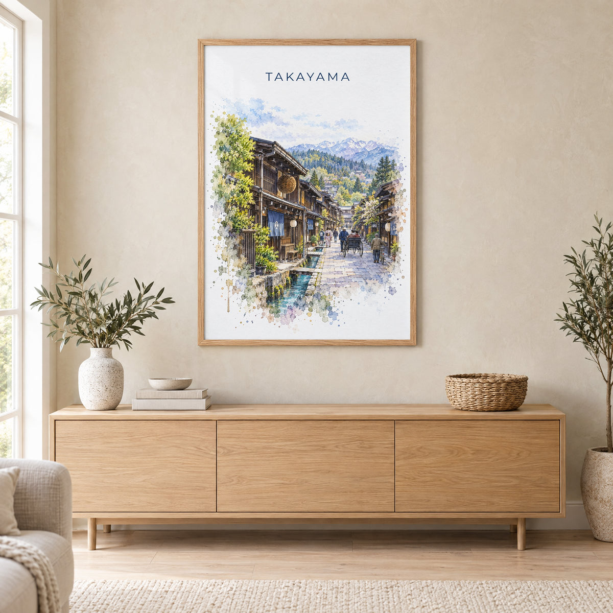 Takayama watercolor print in an oak frame above a light wood sideboard in a Scandinavian living room