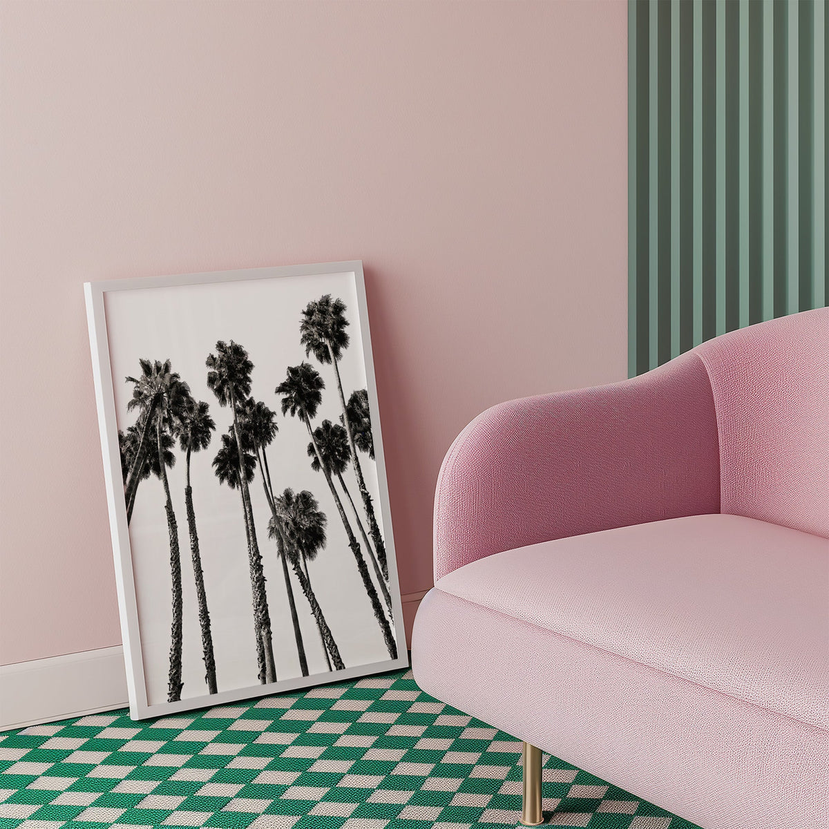 Dense fan palm grove seen from below print in a white frame beside a pink armchair on a checkered floor