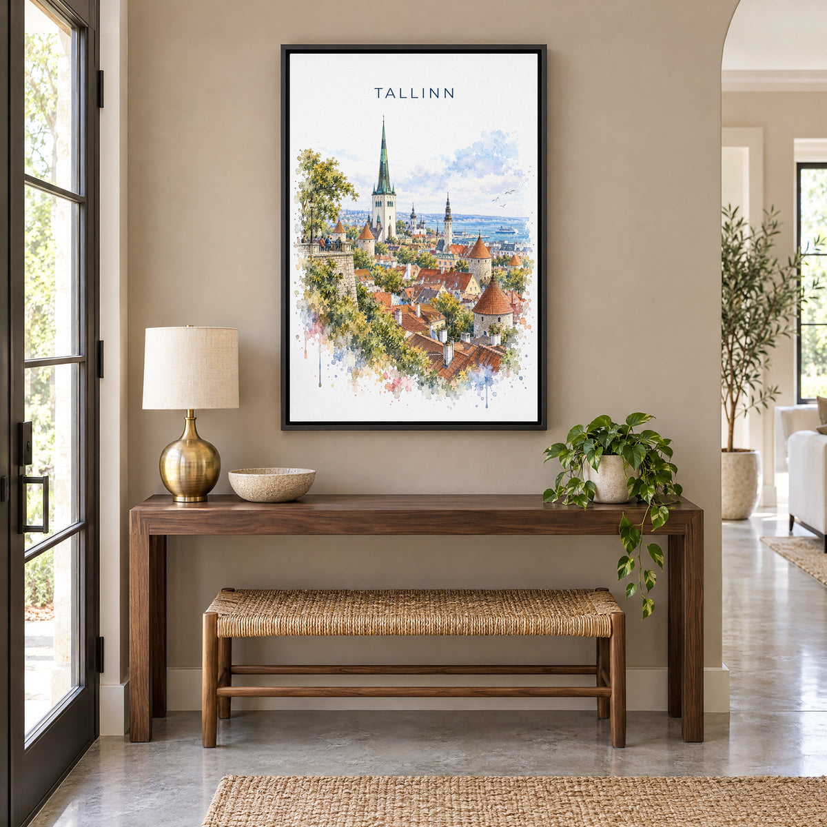 Tallinn watercolor print as a black floater canvas above a walnut console and woven bench in an entryway