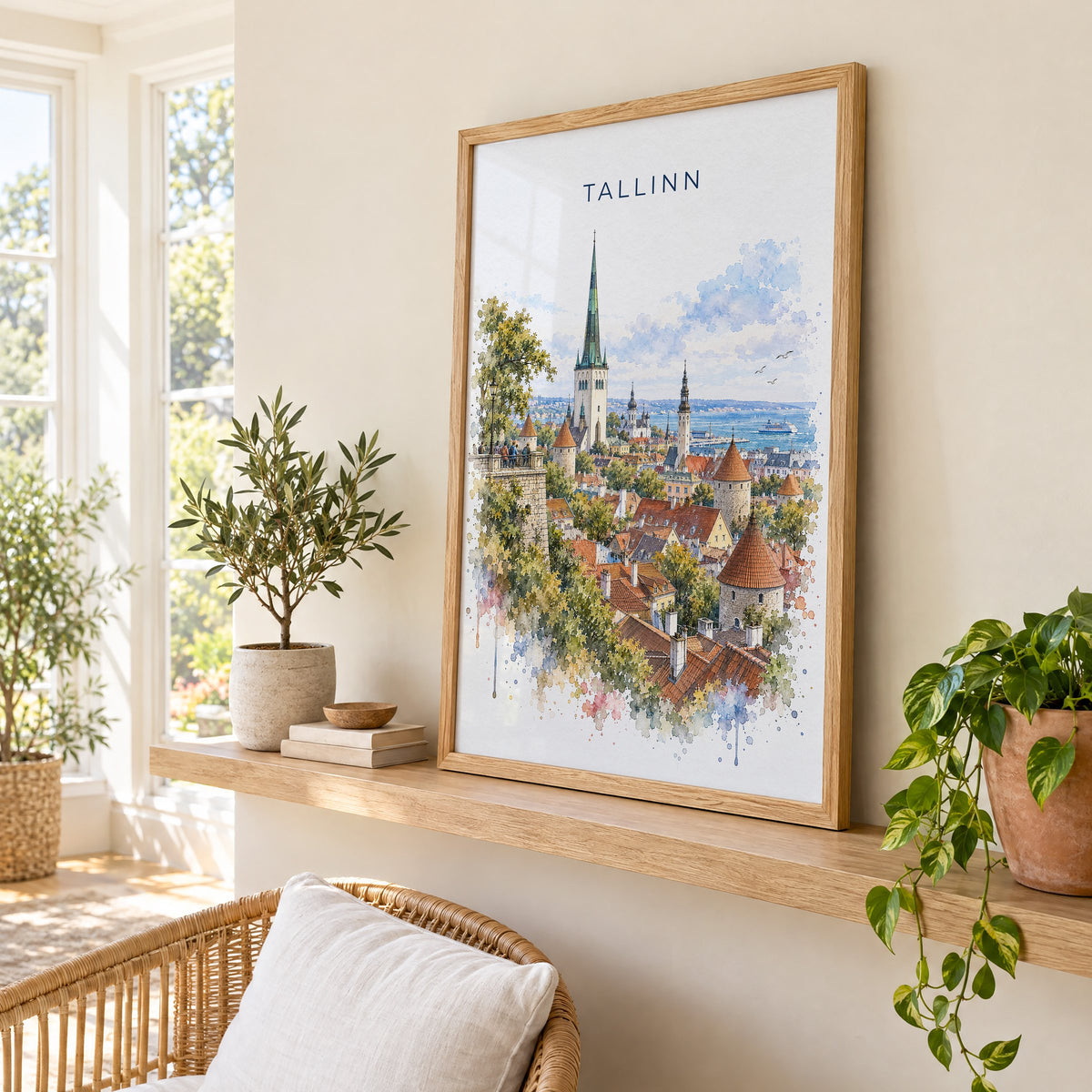 Tallinn watercolor print in an oak frame on a picture ledge in a sunlit sunroom