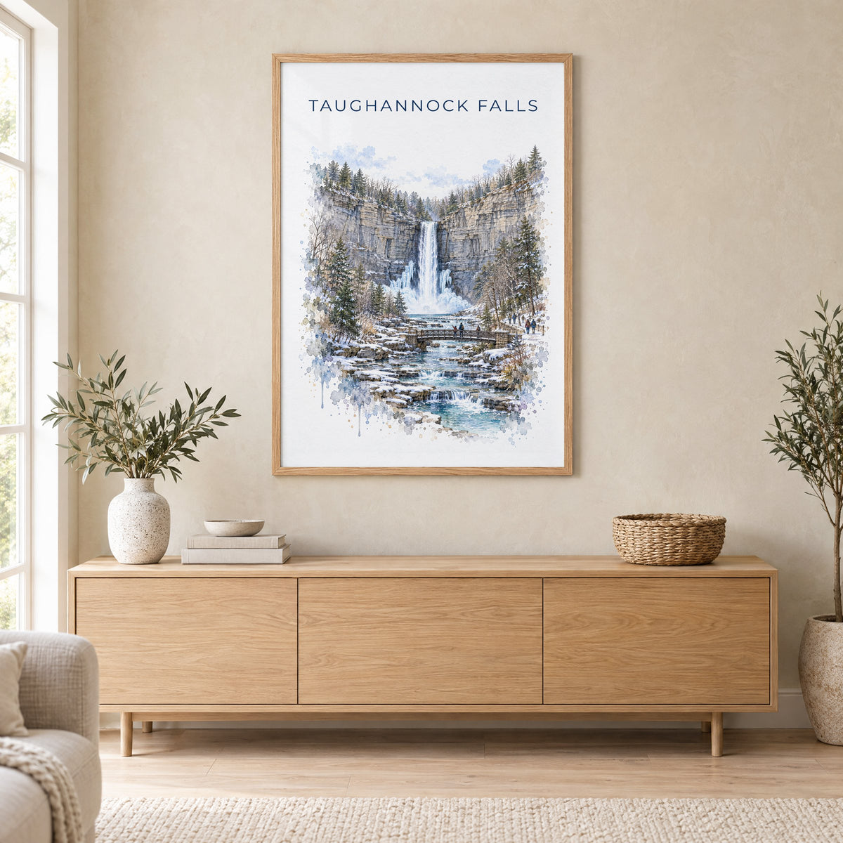 Taughannock Falls State Park watercolor print in an oak frame above a light wood sideboard in a Scandinavian living room