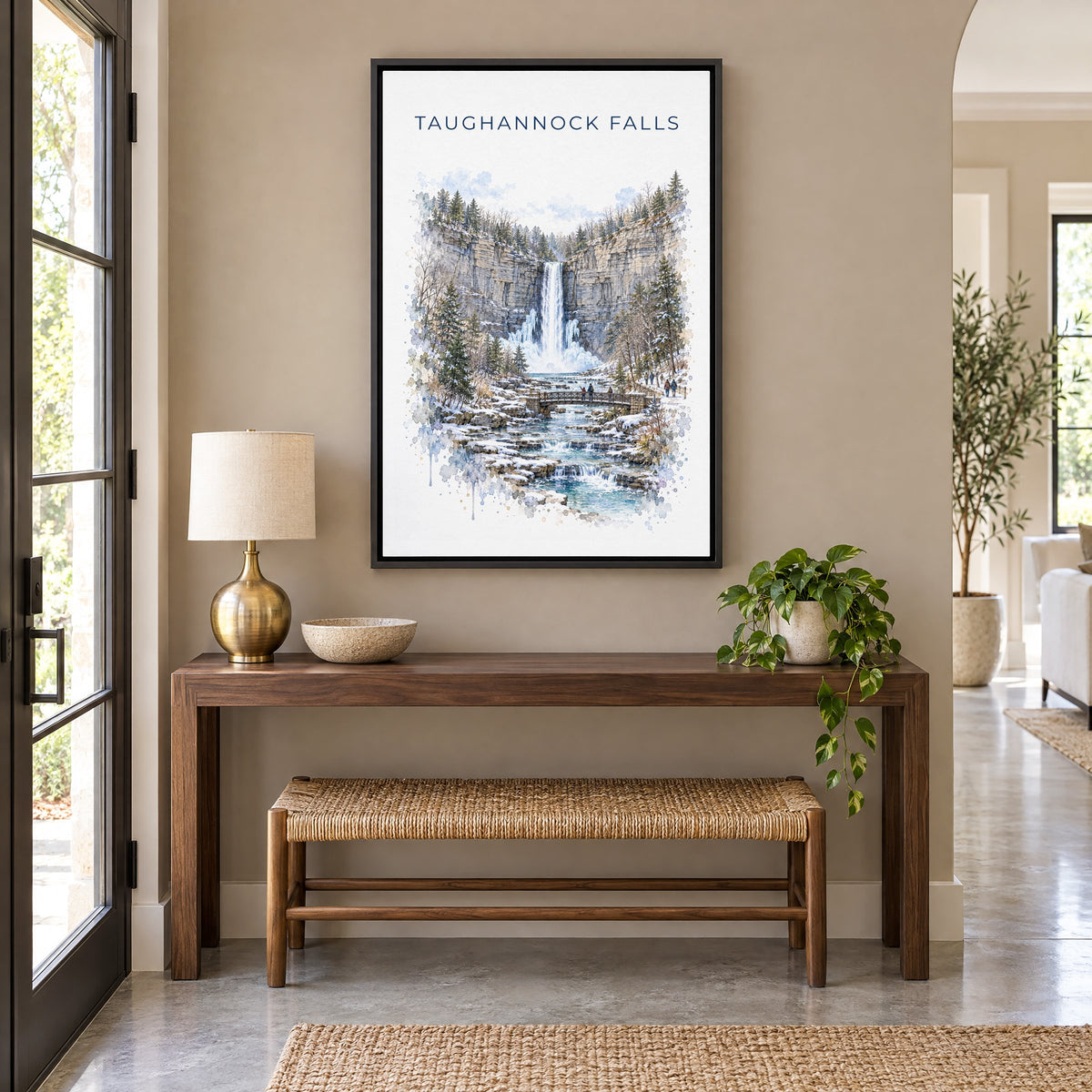 Taughannock Falls State Park watercolor print as a black floater canvas above a walnut console and woven bench in an entryway