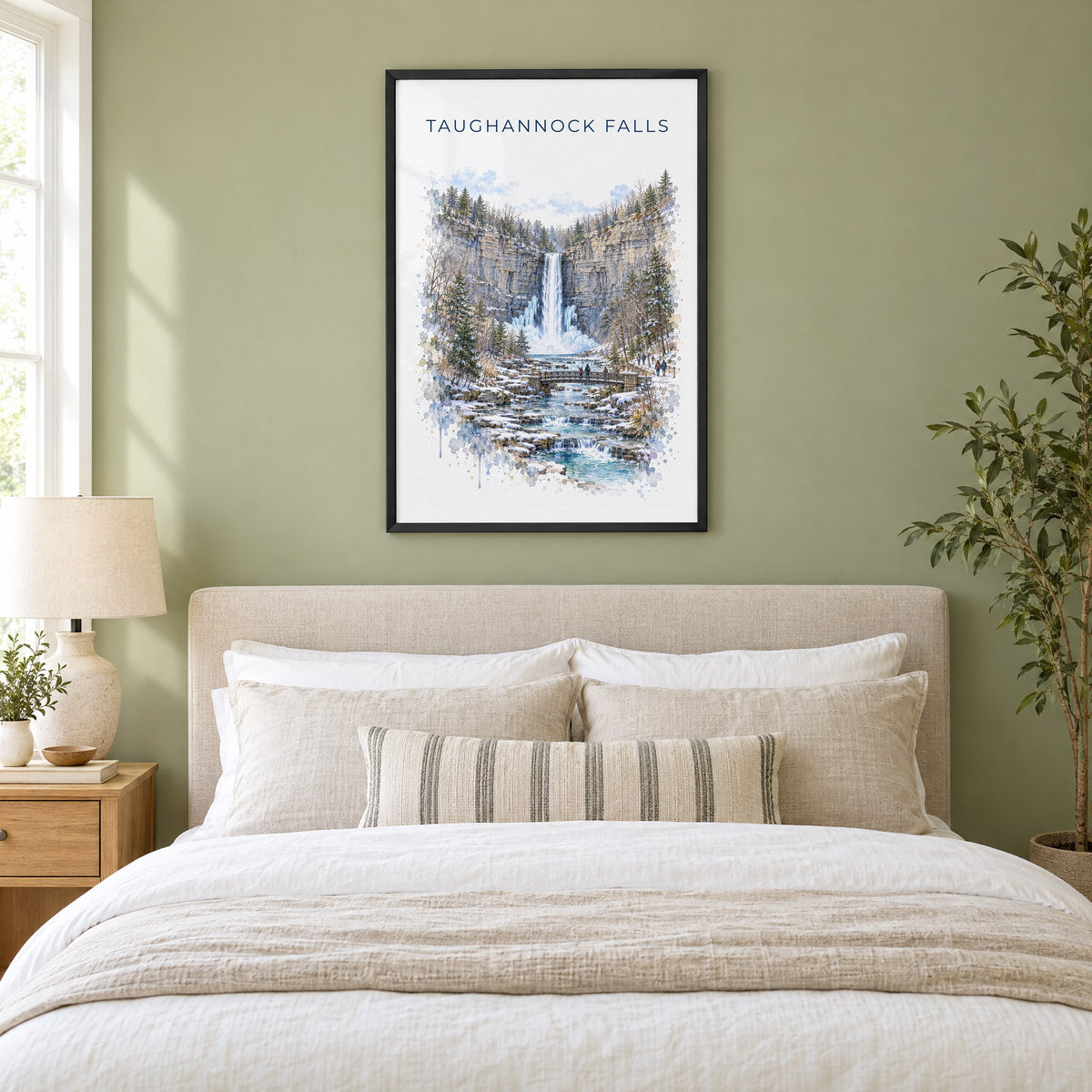 Taughannock Falls State Park watercolor print in a black frame above an upholstered headboard in a sage green bedroom