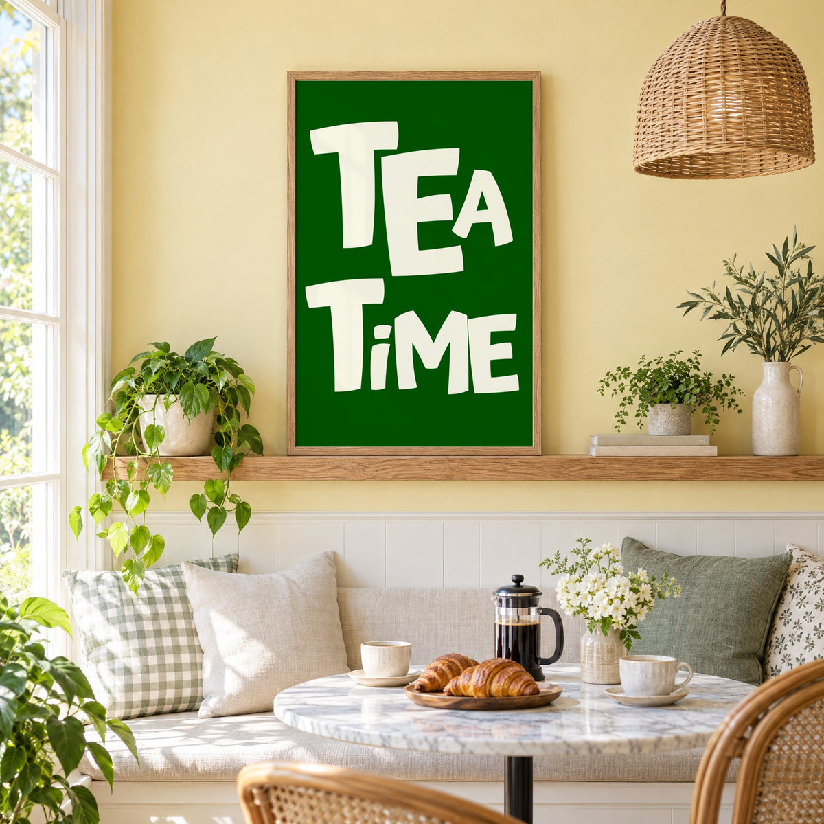 TEA TiME green typography print in an oak frame on a picture ledge above a sunny breakfast nook