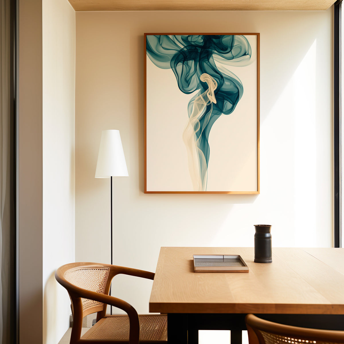 Teal smoke swirl fluid abstract print in a slim oak frame above a dining table with a cane-back chair
