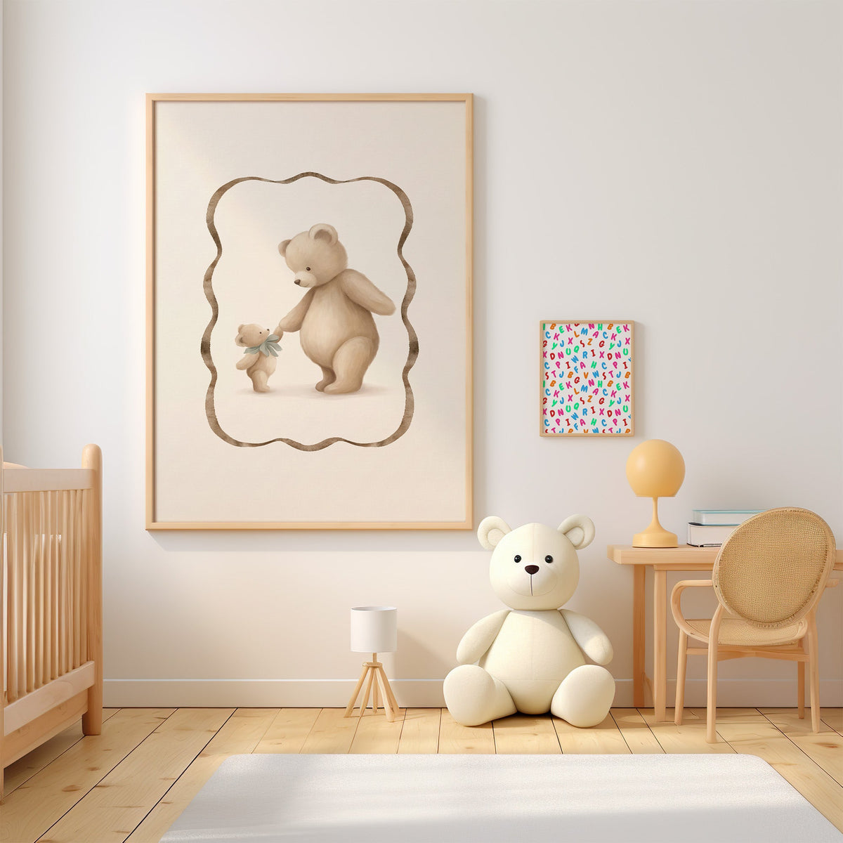 Big and little teddy bears holding hands nursery print in an oak frame above a wooden crib beside a cream teddy bear