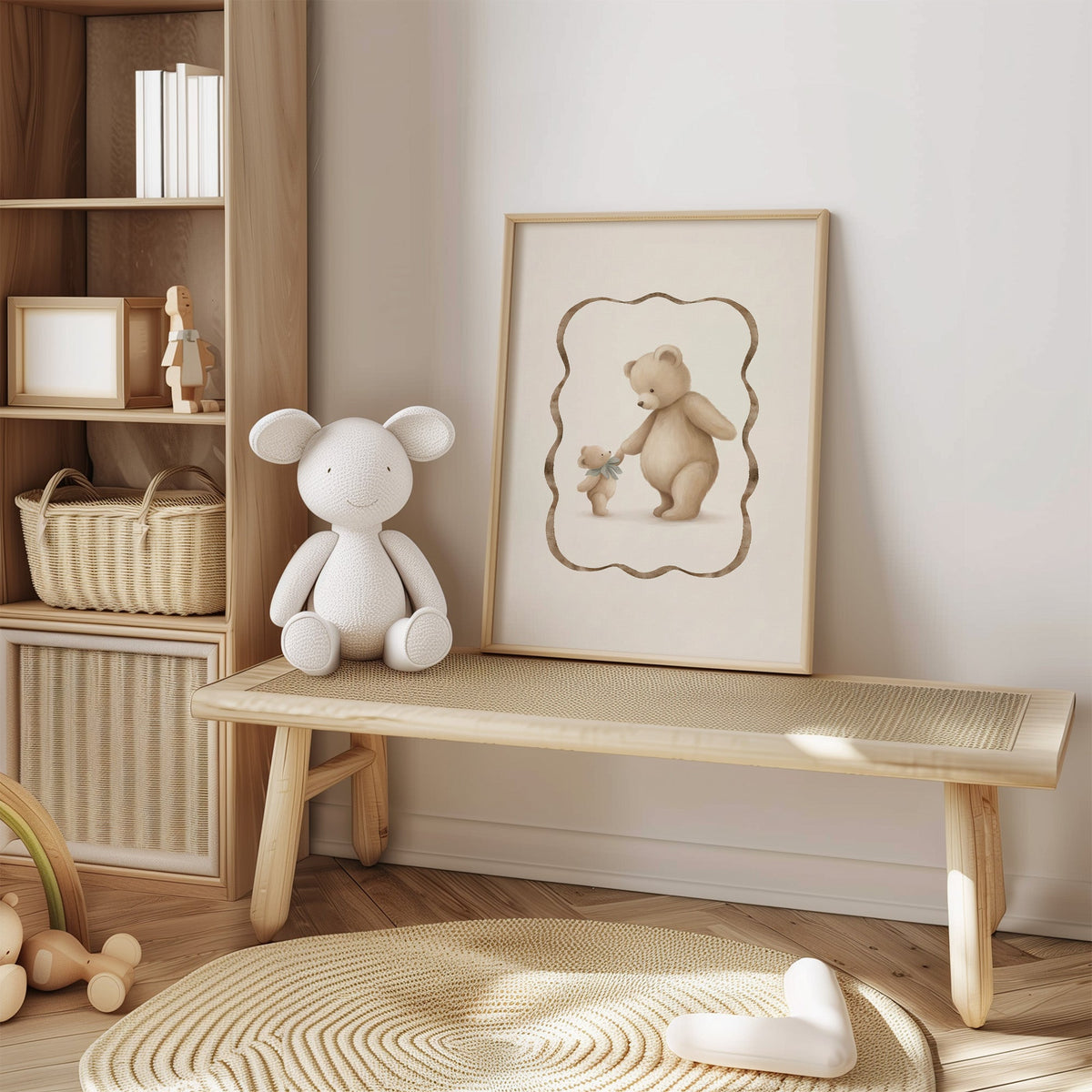 Big and little teddy bears holding hands nursery print in an oak frame on a cane bench beside a white knit plush