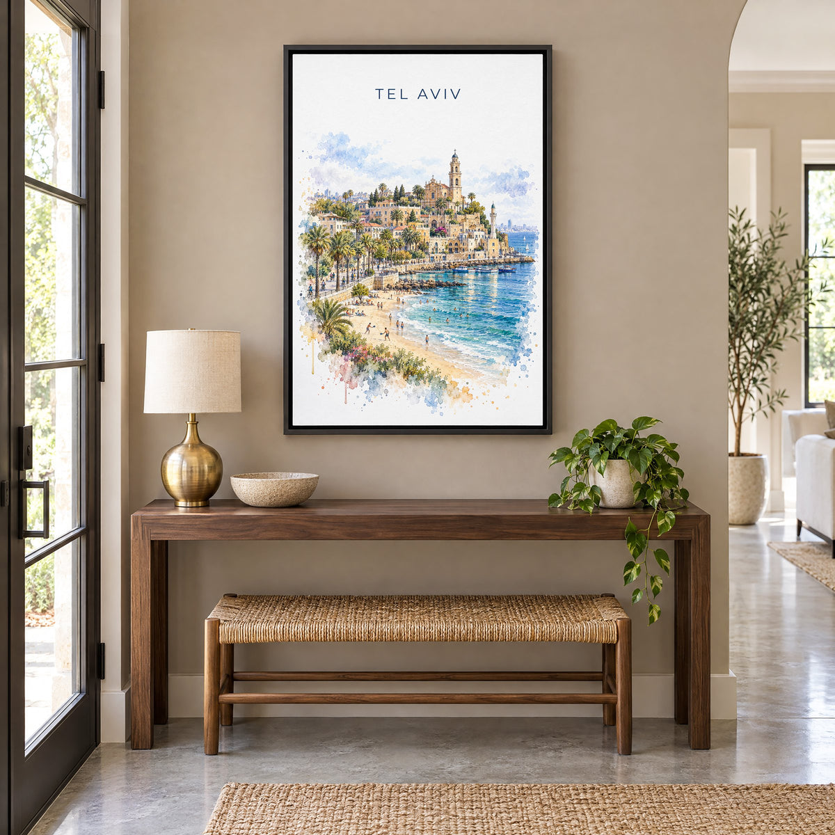Tel Aviv watercolor print as a black floater canvas above a walnut console and woven bench in an entryway