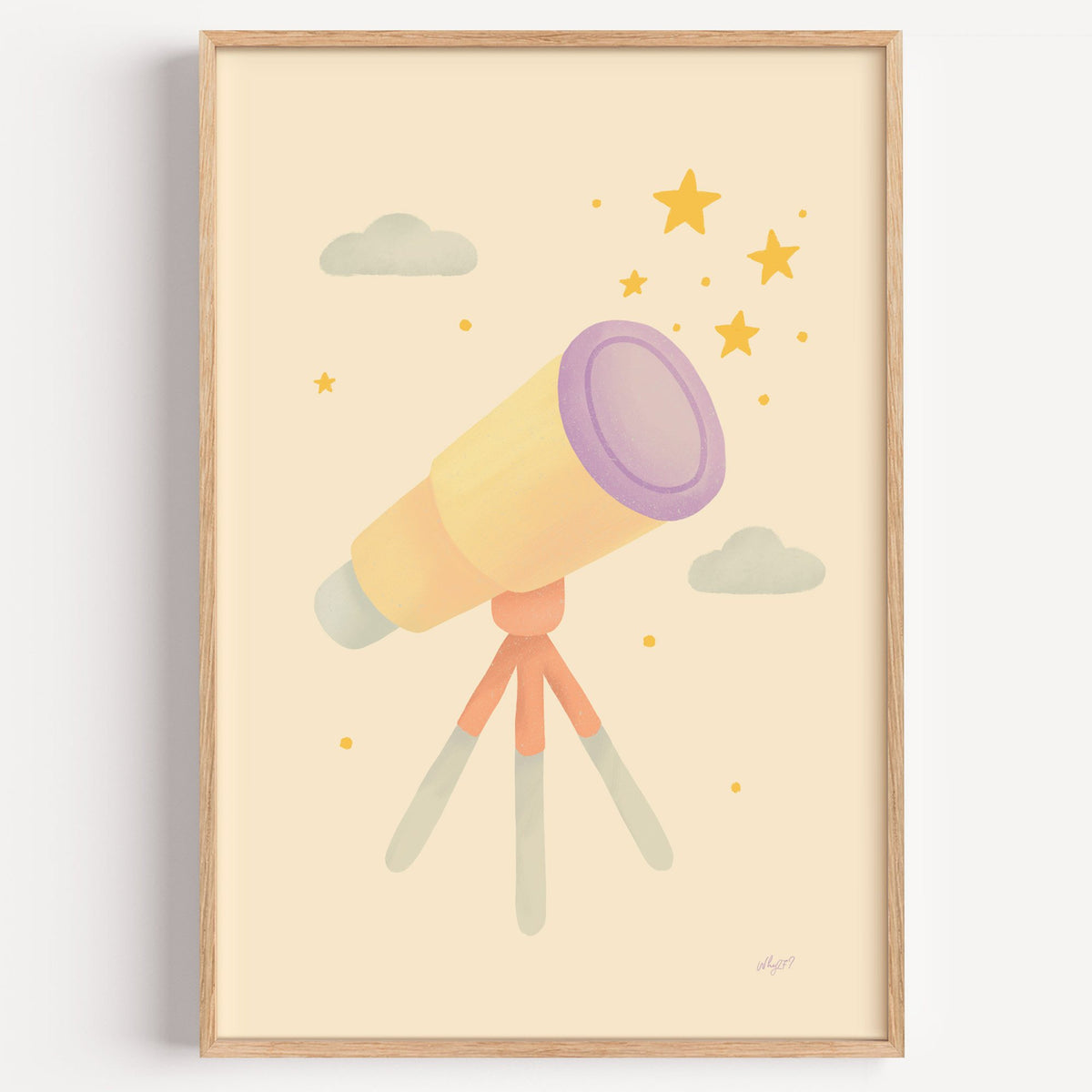 Pastel telescope and gold stars nursery print in a light oak frame on a plain white wall