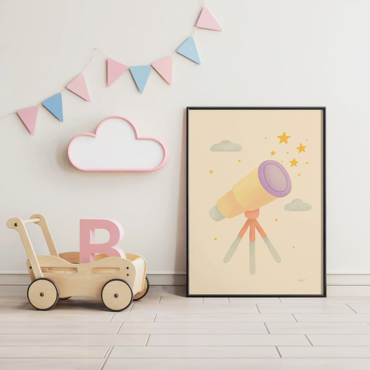 Pastel telescope and gold stars nursery print in a black frame under pastel bunting by a wooden baby walker