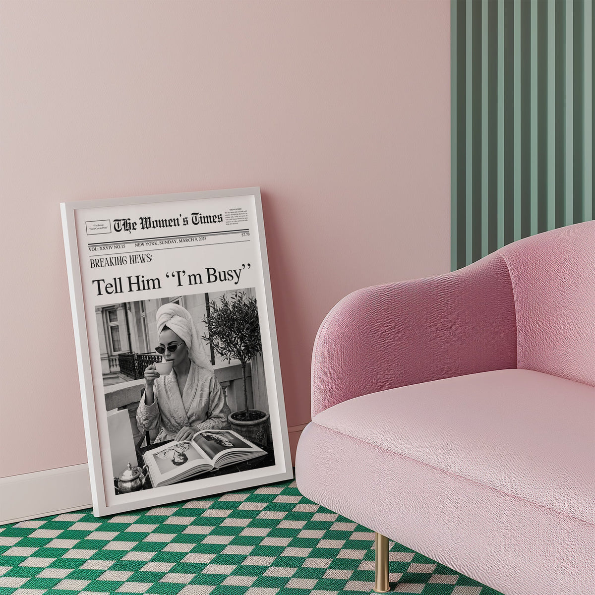 Woman with tea and photo book on balcony newspaper print in a white frame beside a pink armchair on a checkered floor