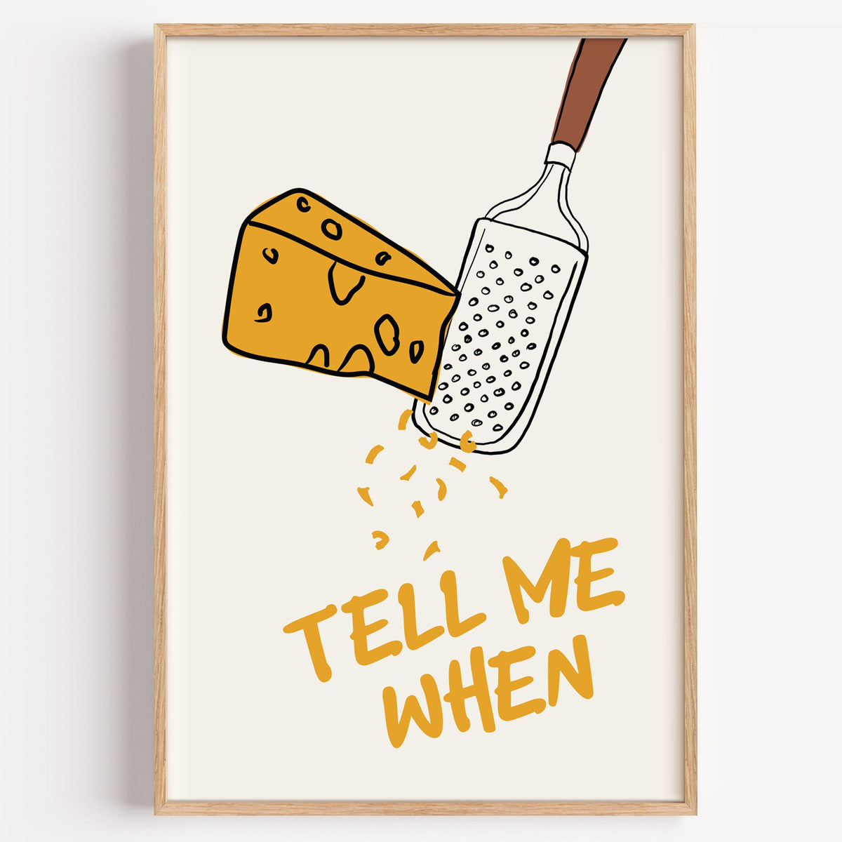 Tell me when cheese grater print in a light oak frame on a plain white wall