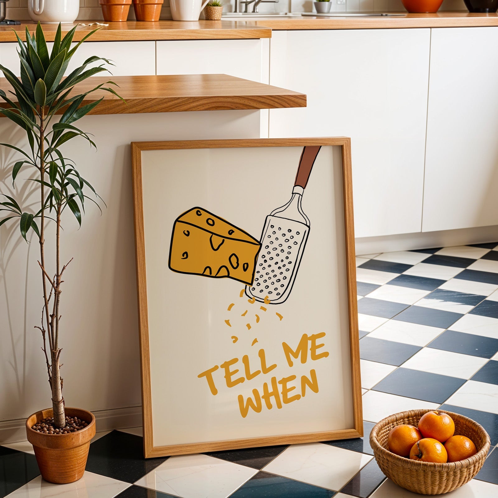Tell me when cheese grater print in an oak frame by a kitchen island and tiled floor