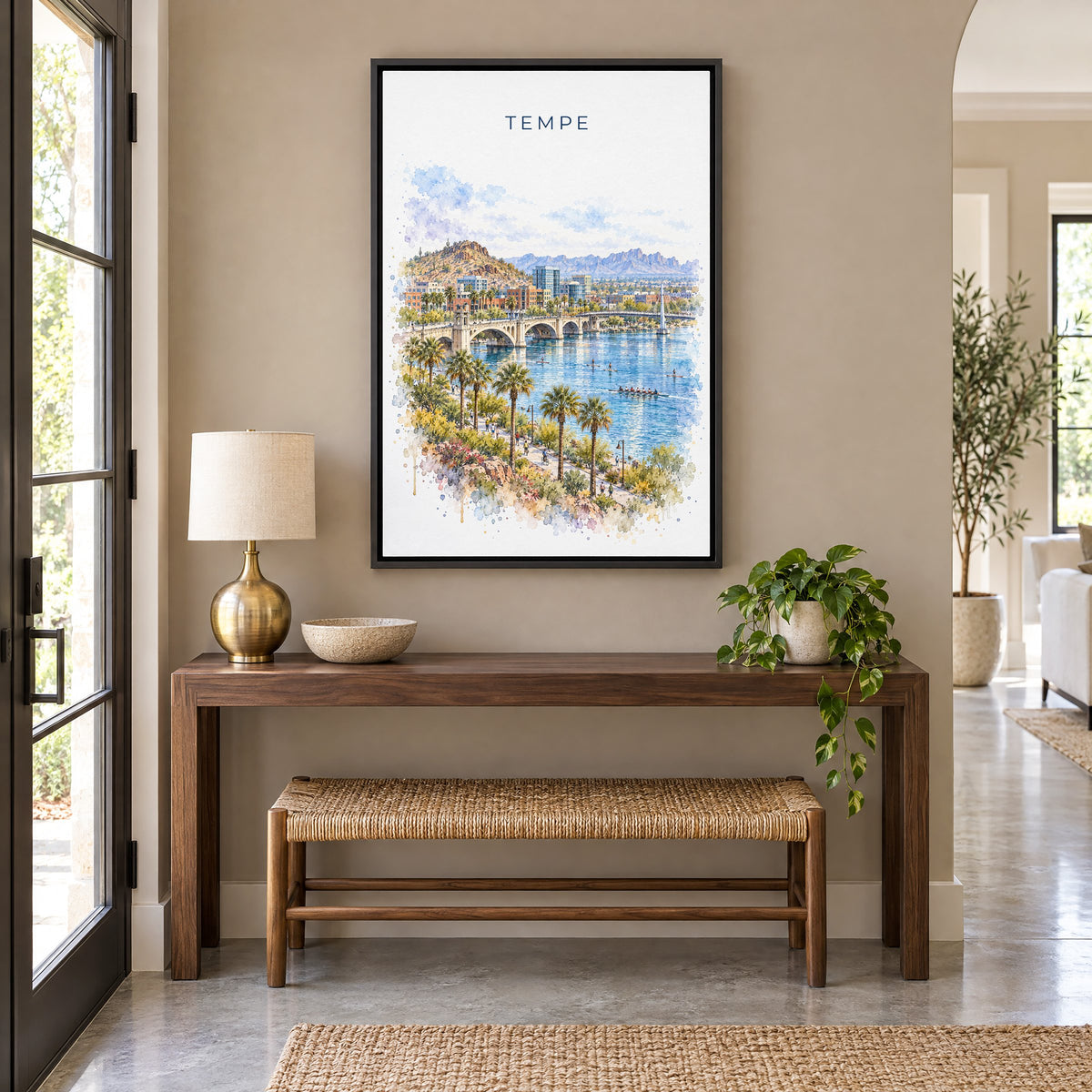 Tempe watercolor print as a black floater canvas above a walnut console and woven bench in an entryway