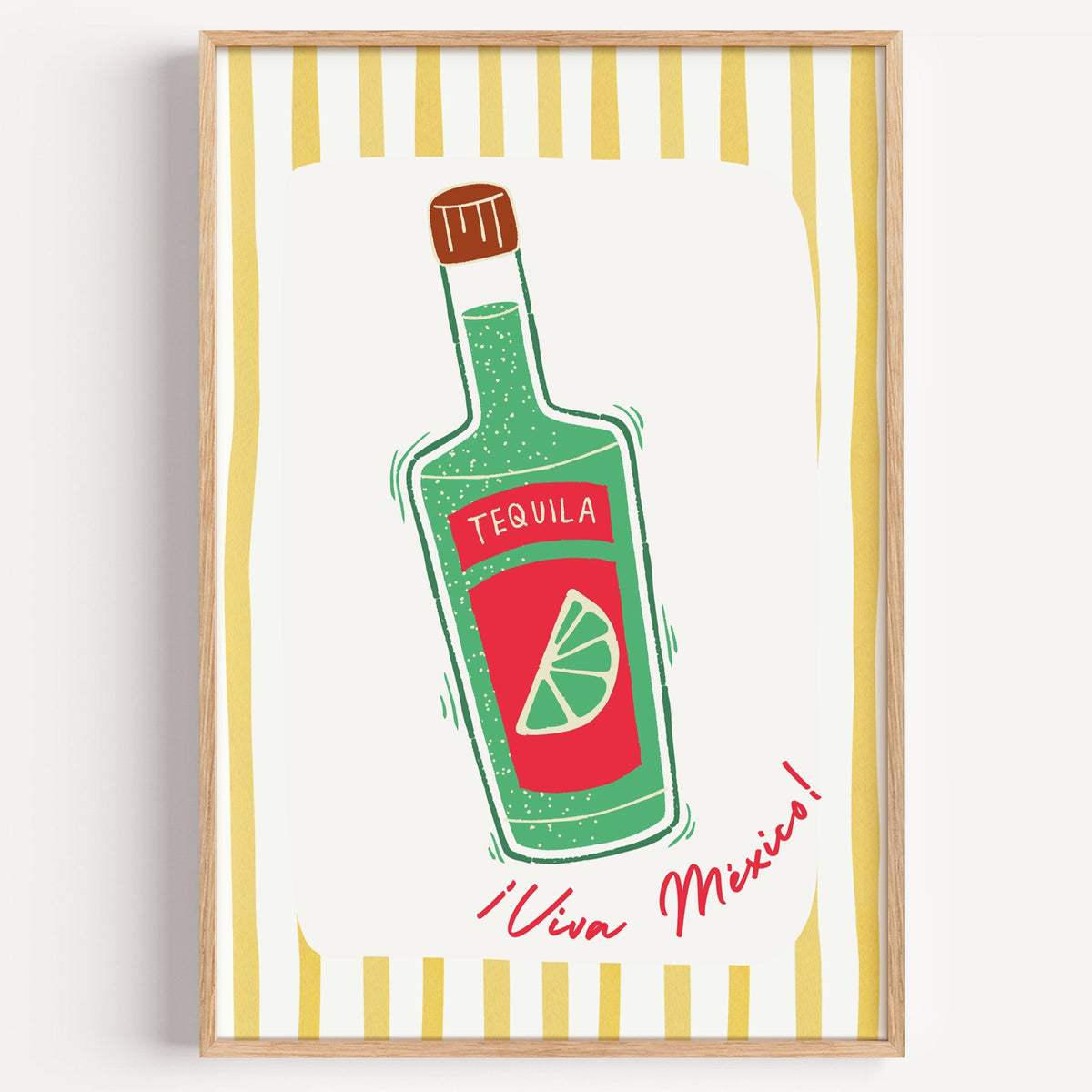 Tequila bottle print in a light oak frame on a plain white wall