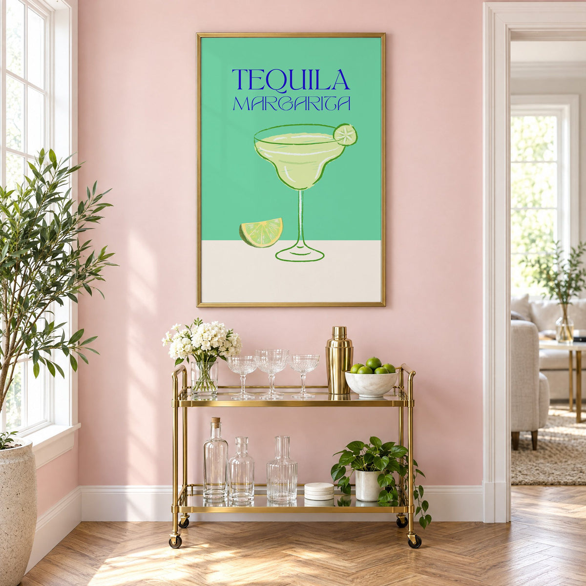 TEQUILA MARGARITA green glass and lime print in a brass frame on a blush pink wall above a gold bar cart with glassware