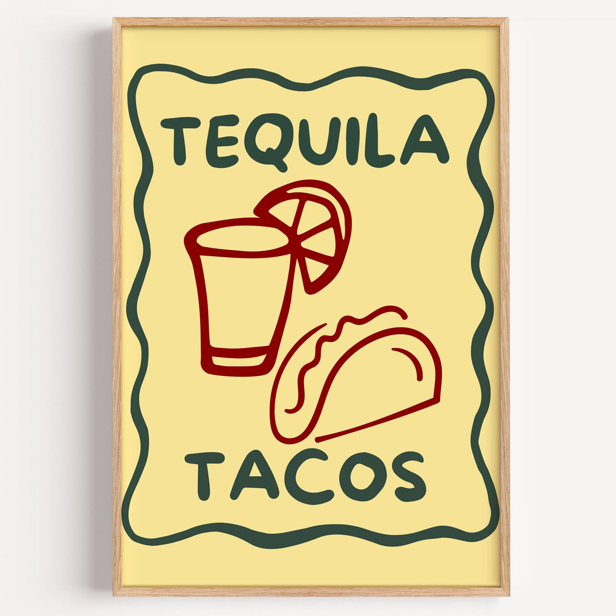 Tequila Tacos yellow frame print in a light oak frame on a plain white wall