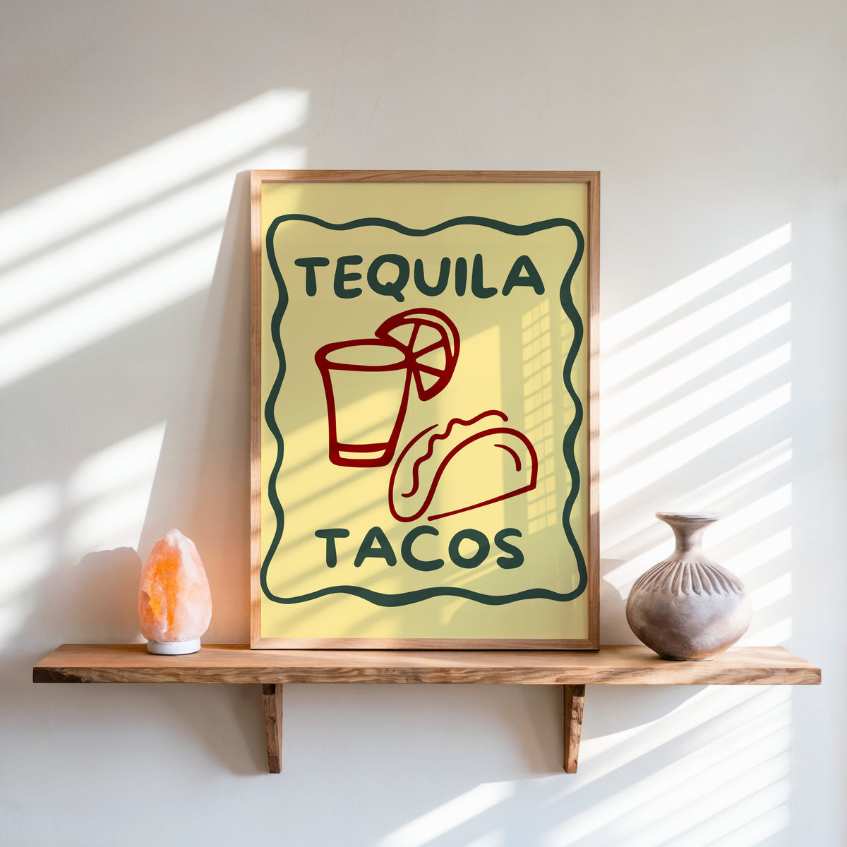 Tequila Tacos print in an oak frame on a live-edge shelf beside a salt lamp