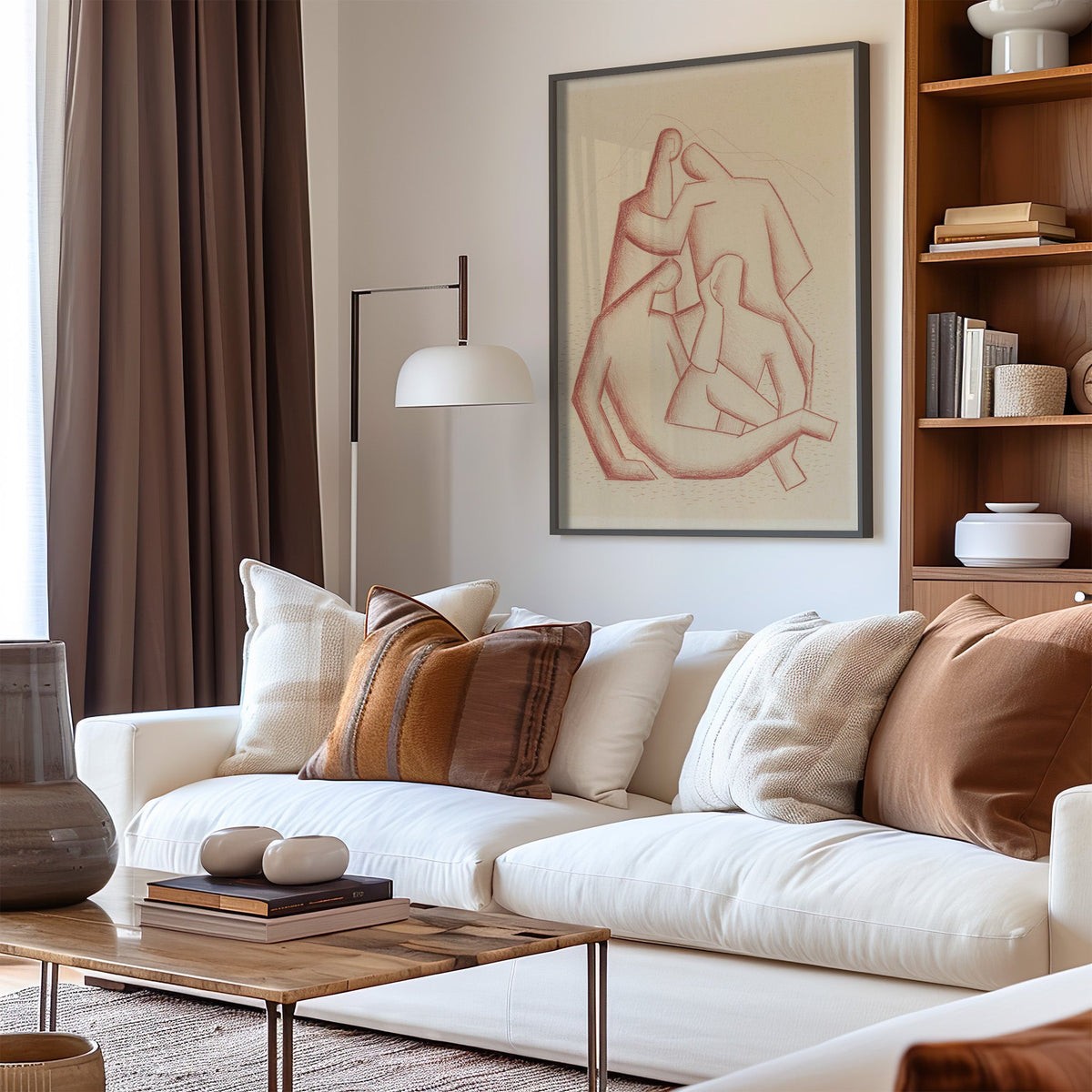 Terracotta chalk cubist figures group sketch print in a black frame above a cream sofa with brown striped pillows
