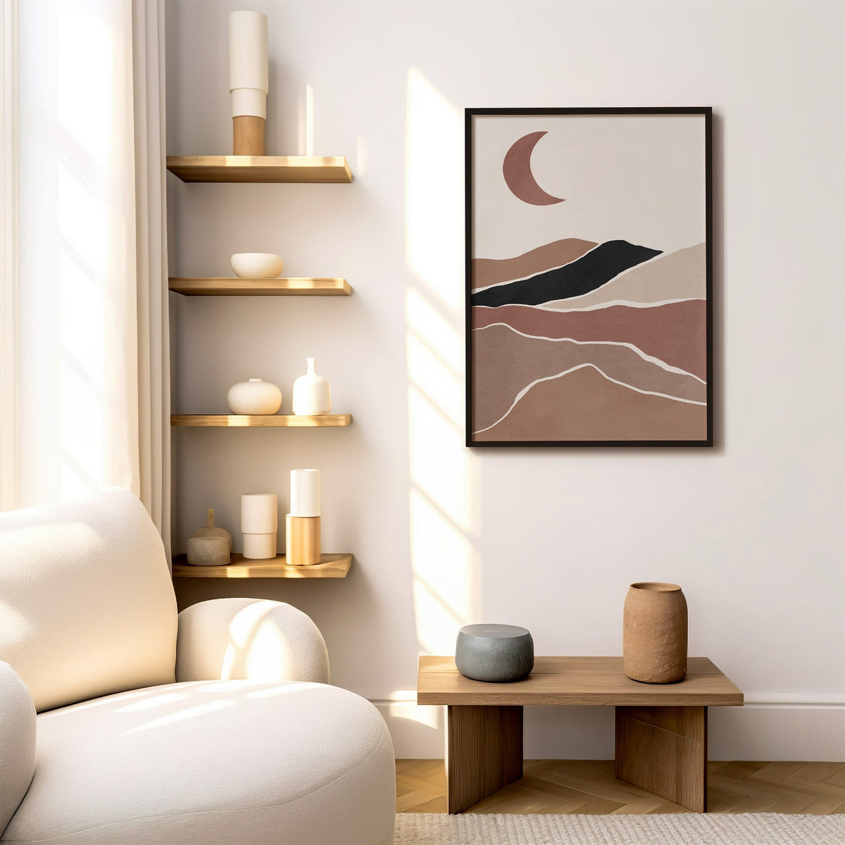 Terracotta crescent moon over hills boho print in a black frame above a low wood bench beside floating oak shelves