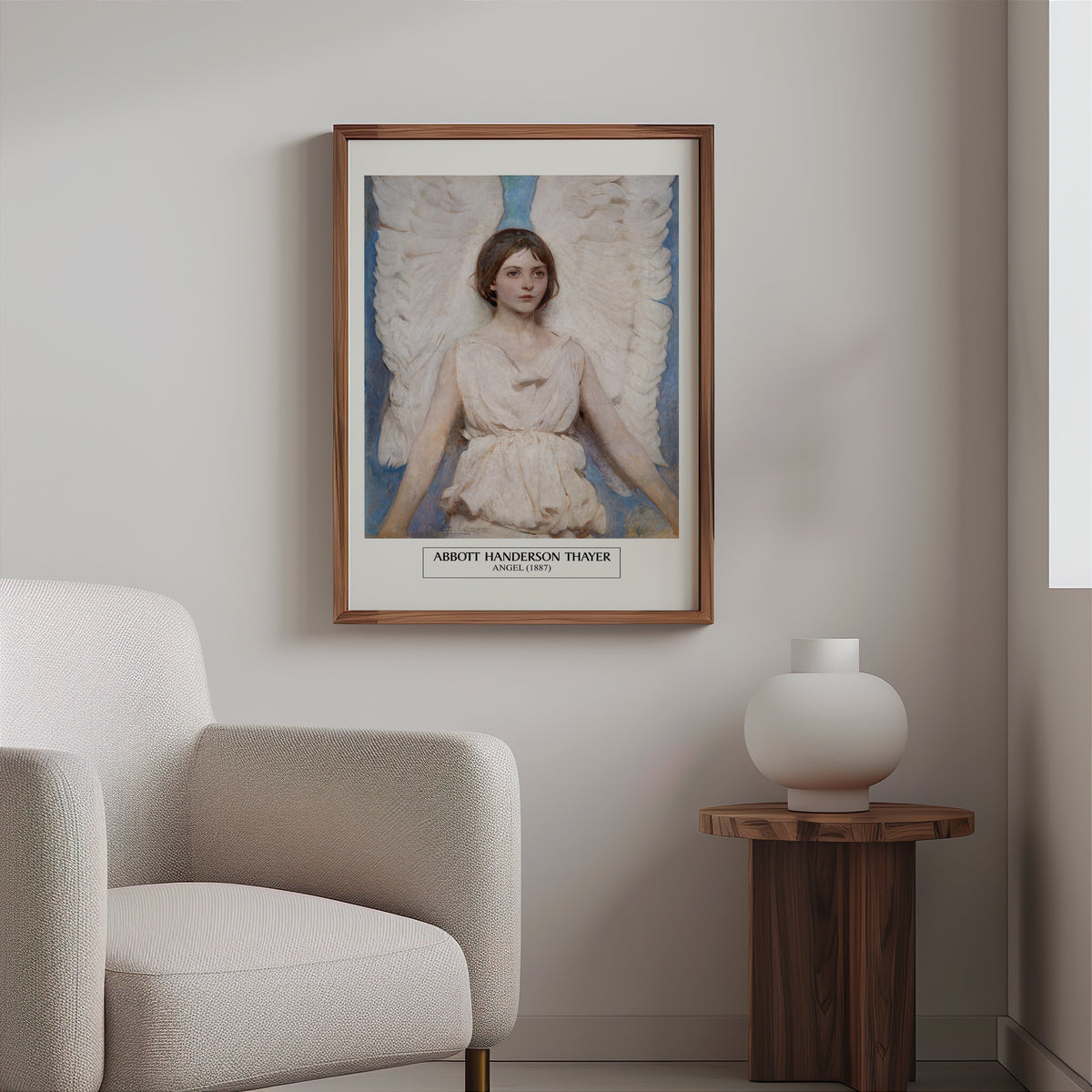Thayer angel painting print in a slim walnut frame above a bouclé armchair