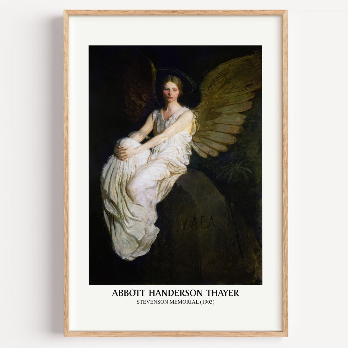 Abbott Thayer Stevenson Memorial print in a light oak frame on a white wall