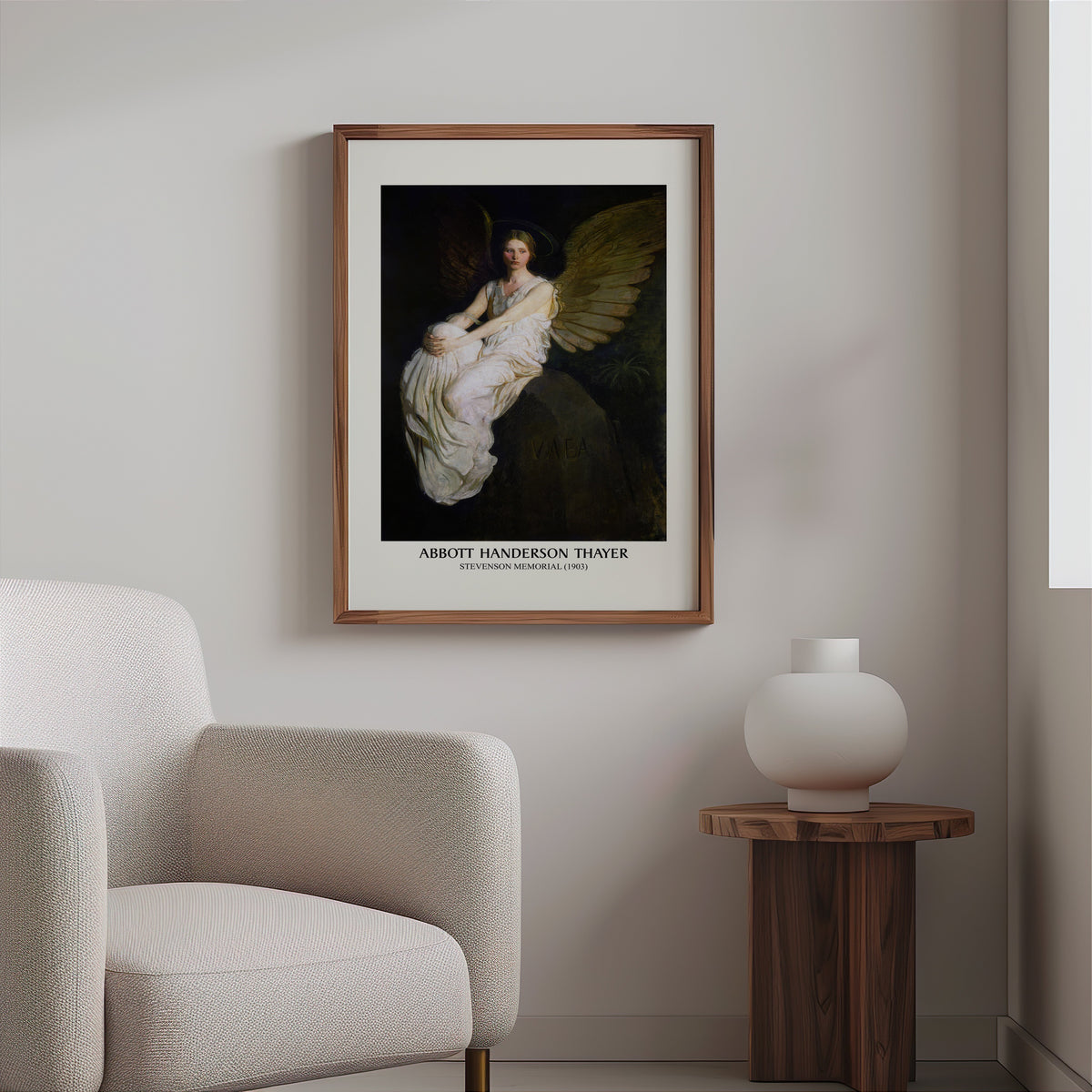 Thayer angel print in a slim walnut frame above a bouclé armchair