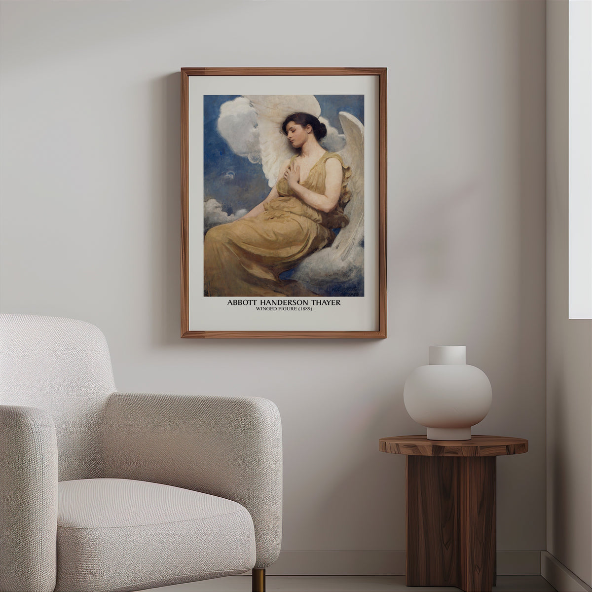 Winged figure painting print in a slim walnut frame above a bouclé armchair