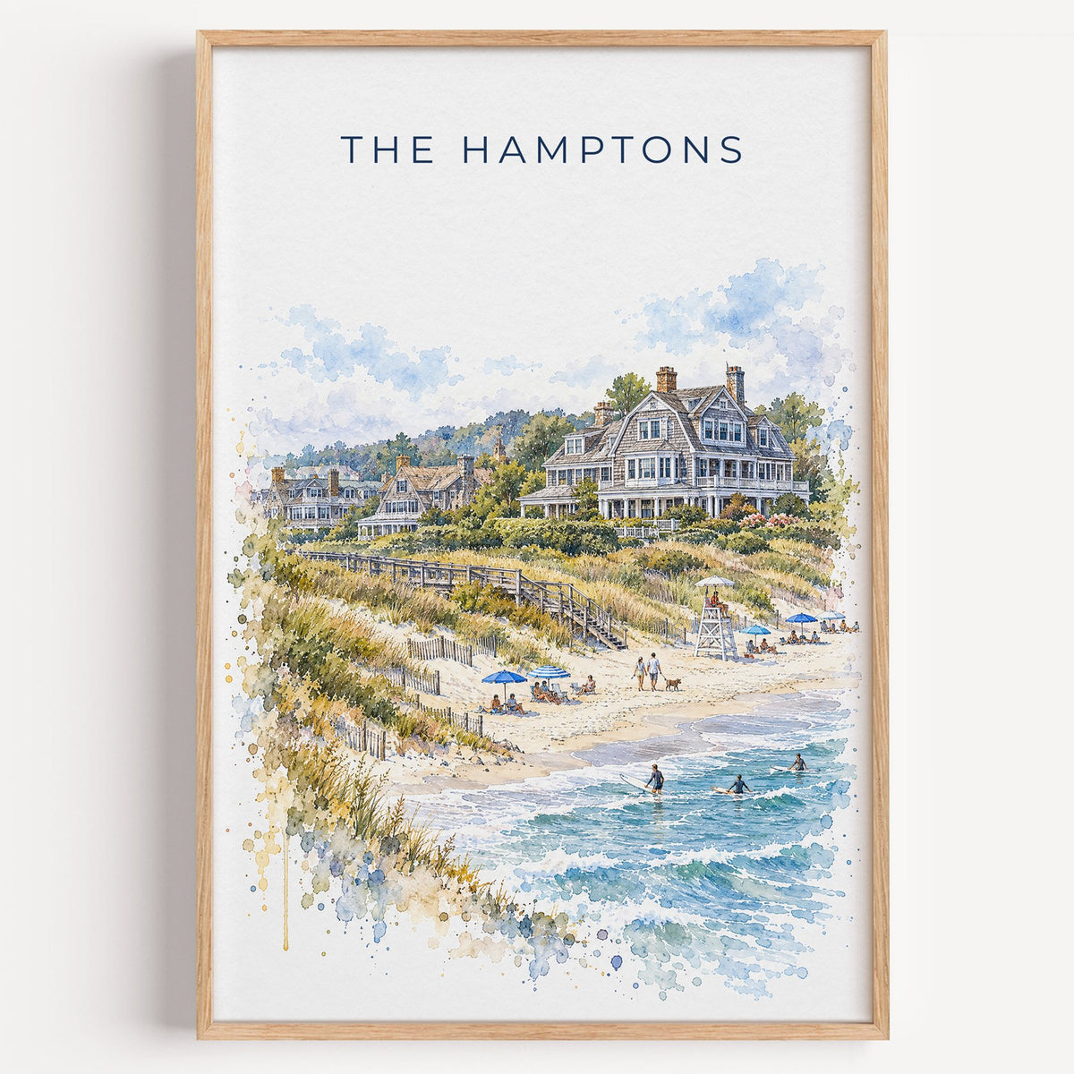 The Hamptons watercolor print in a light oak frame on a plain white wall