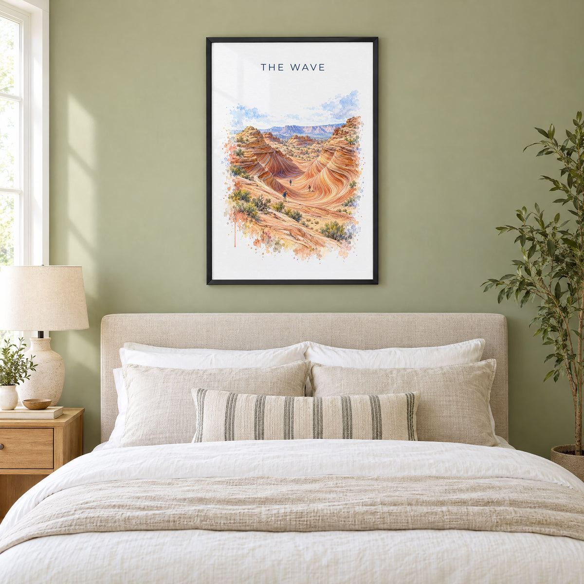 The Wave, Arizona watercolor print in a black frame above an upholstered headboard in a sage green bedroom