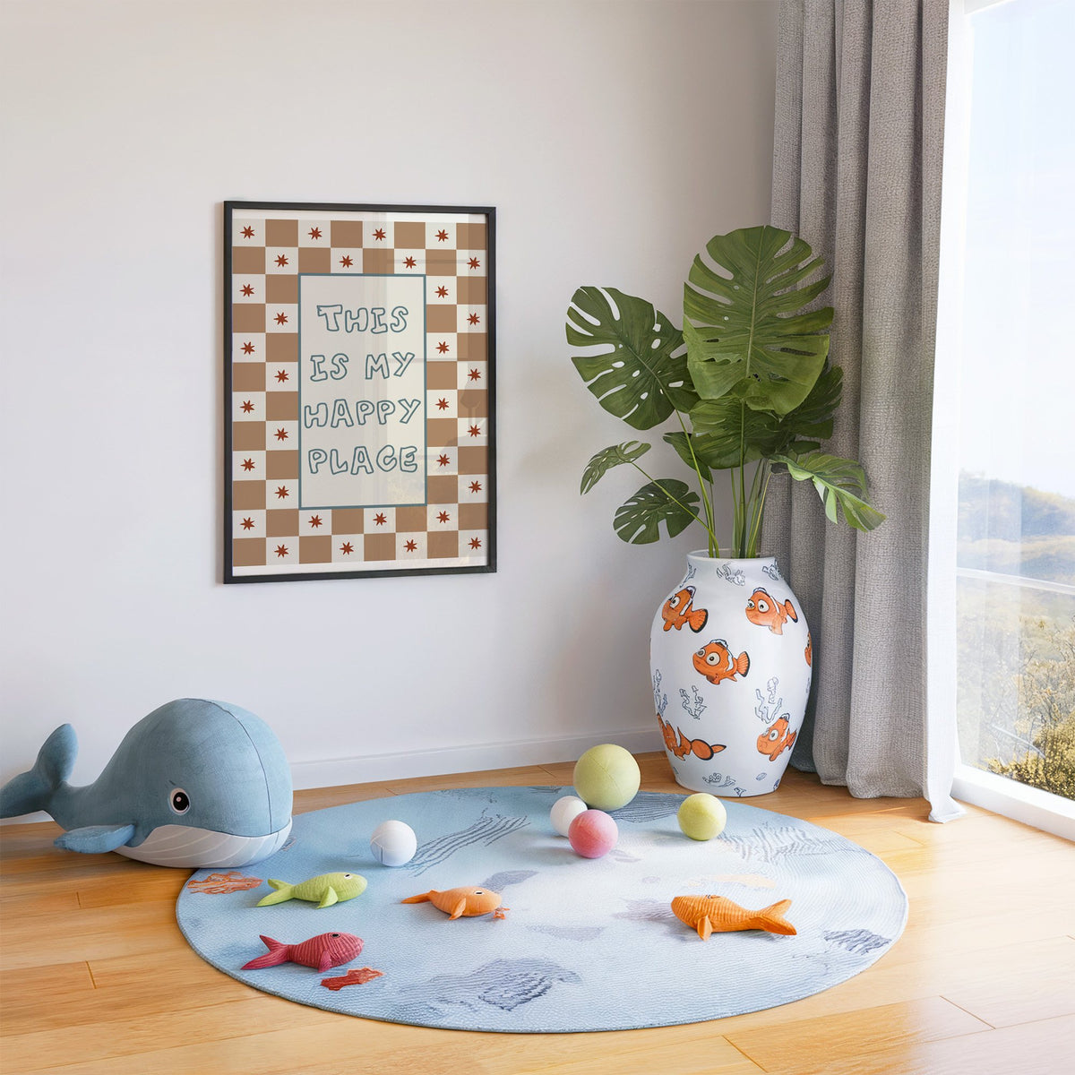 This is my happy place nursery print in a black frame in a playroom with an ocean rug and whale plush