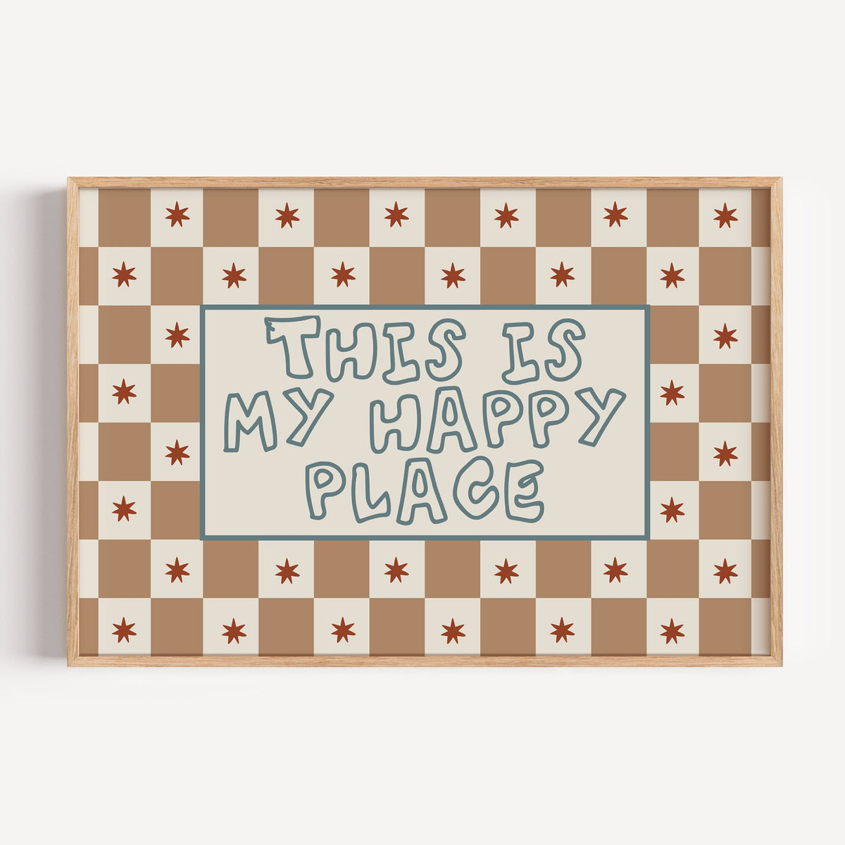 Landscape this is my happy place nursery print in a light oak frame on a plain white wall