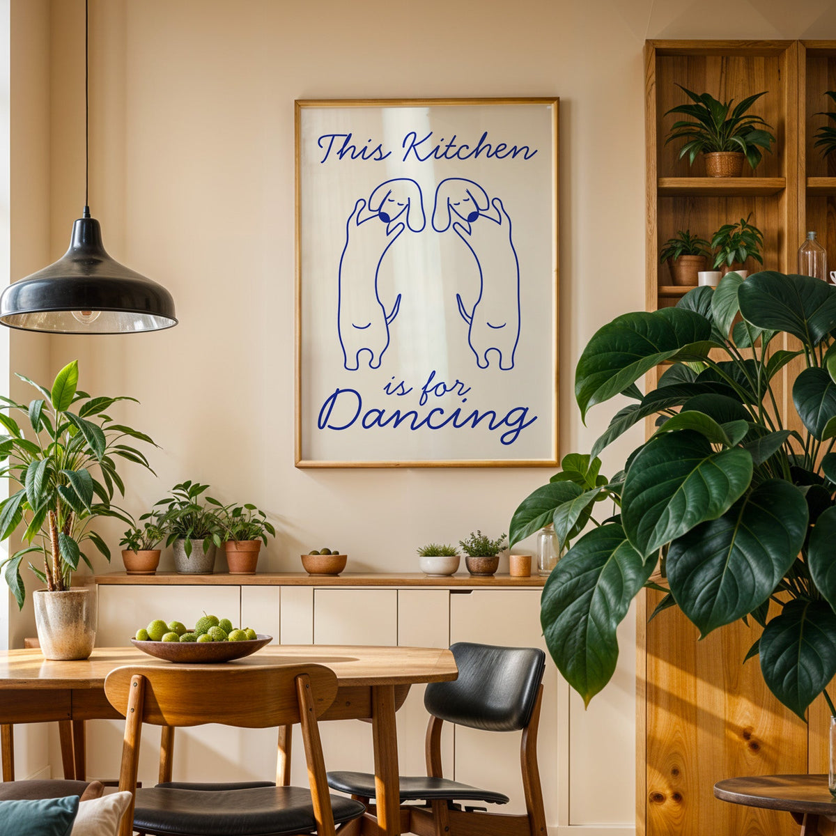 Dachshunds kitchen dancing print in an oak frame above a sideboard in a dining room