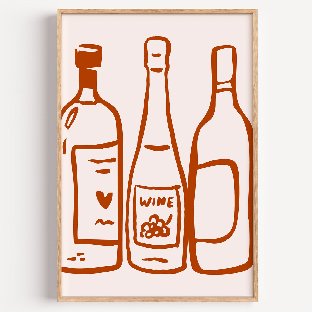 Three wine bottles rust brush line print in a light oak frame on a plain white wall
