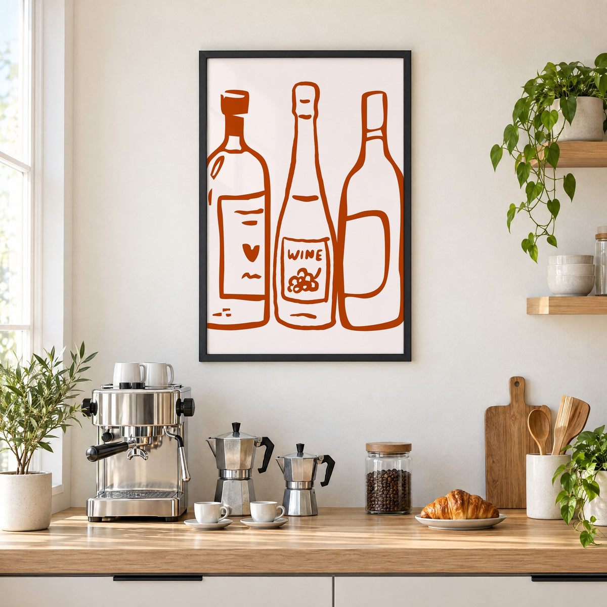 Three wine bottles rust brush line print in a black frame above a home espresso bar with moka pots and espresso cups