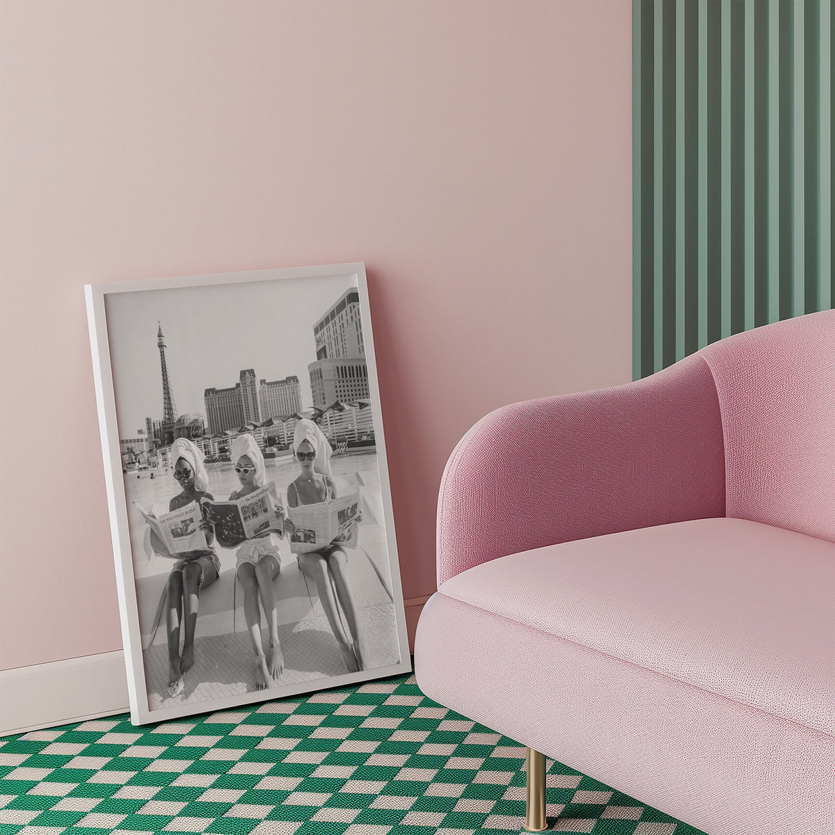 Three women in towel turbans reading newspapers print in a white frame beside a pink armchair on a checkered floor