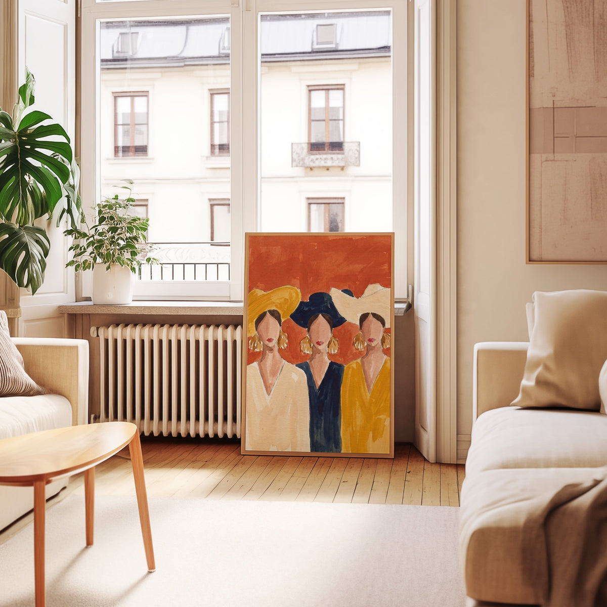 Faceless women portrait print in an oak frame leaning below tall French windows